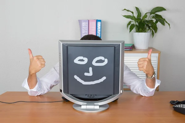 Businessmahiding behind computer  with smiley face