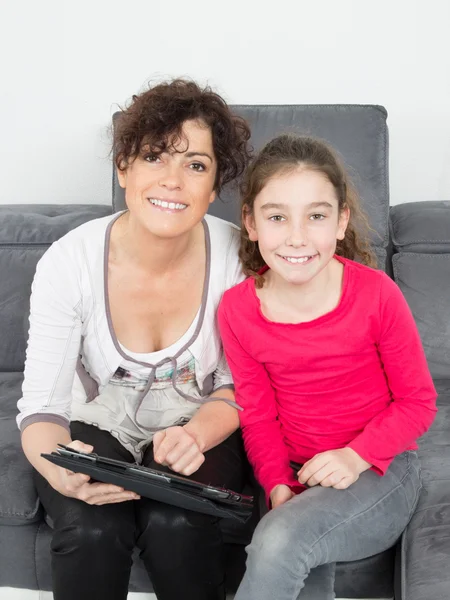 Picture of mother and daughter with tablet pc