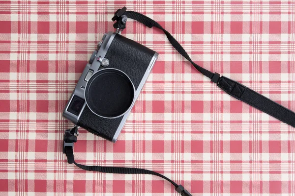 The Vintage camera on vintage red and white background