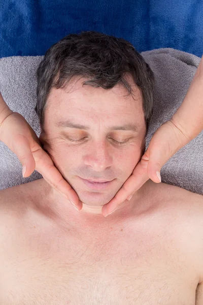 Man getting massaging treatment at health center