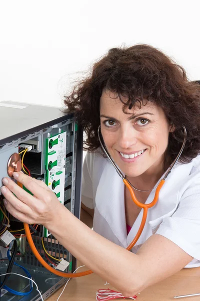 Female  with Stethoscope on computer - woman is fixing computer