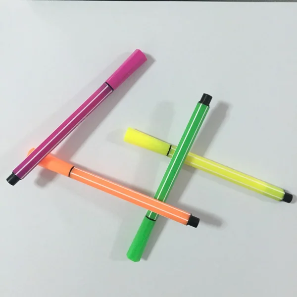 Colored markers on the white background