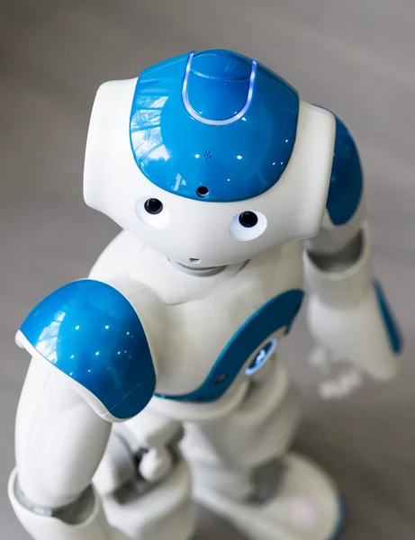Small robot with human face and body. AI