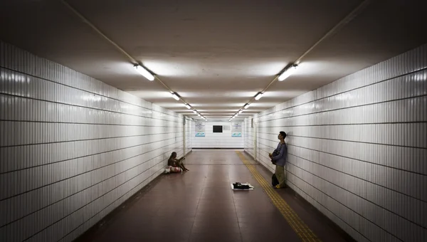 Man singing in an underpass