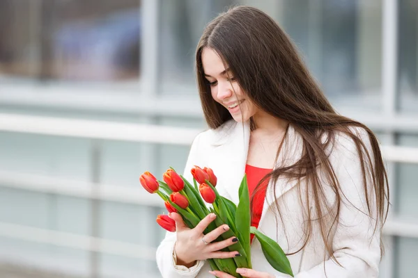 Woman with bouquet of tulips