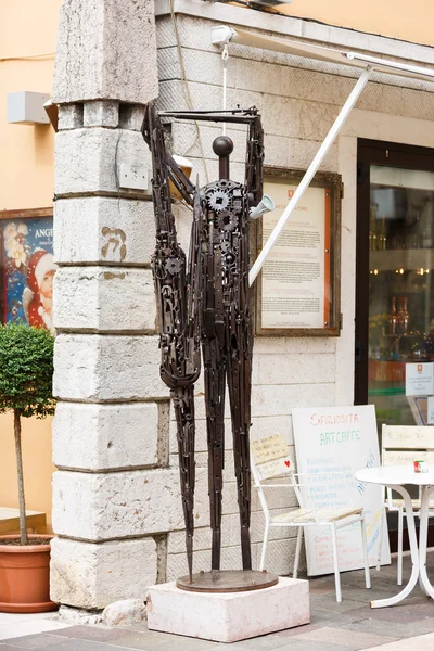 Metal statue in the Garda town
