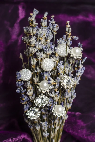 Still life bouquet of lavender with jewels
