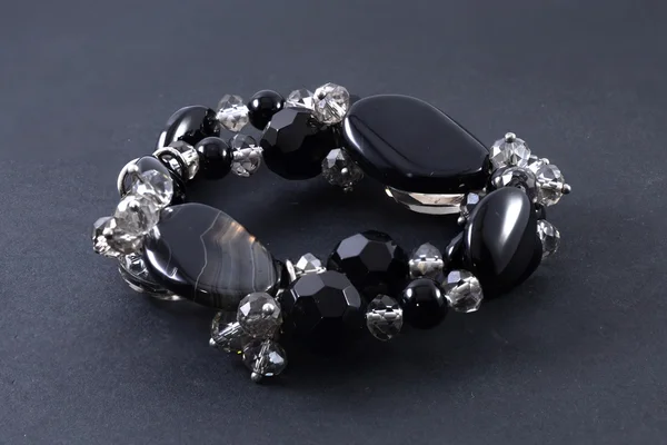 Bracelet of precious stones isolated on black