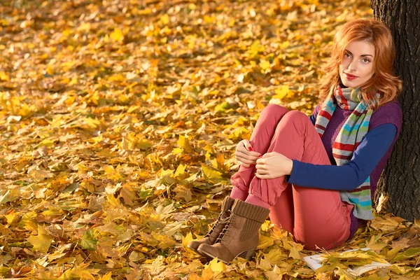 Fall Fashion. Woman in Autumn park,Outdoor.Sadness