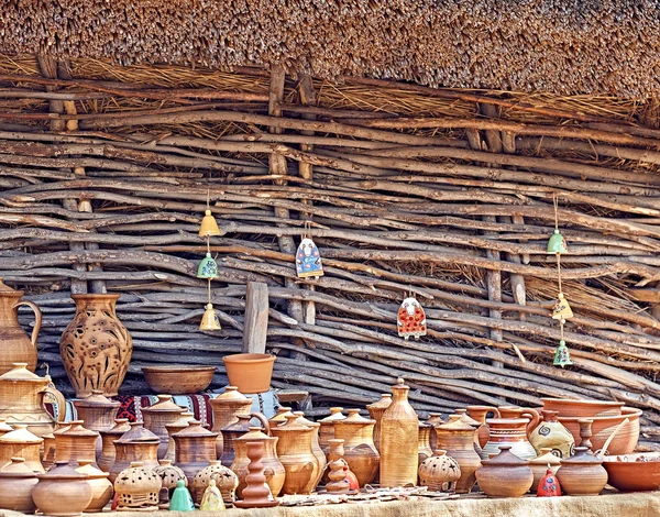Ethnic background texture, art. Exposition of jugs, vases, pots