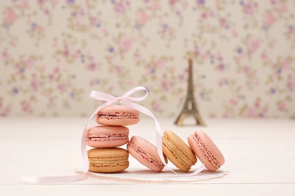 Macarons french dessert. Eiffel Tower on wood