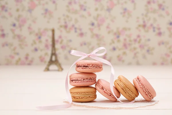 Macarons french dessert. Eiffel Tower on wood