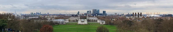 London, UK - circa March 2012: Panorama of Queen\'s House, Isle of Dogs, Canary Wharf and City of London from Royal Observatory of  Greenwich
