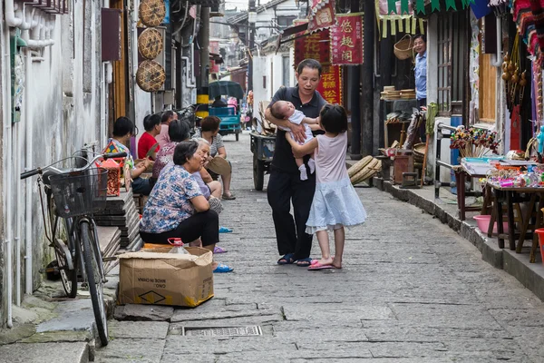 Fengjing Zhujiajiao, China - circa September 2015: People on the streets of Fengjing Zhujiajiao ancient water  town
