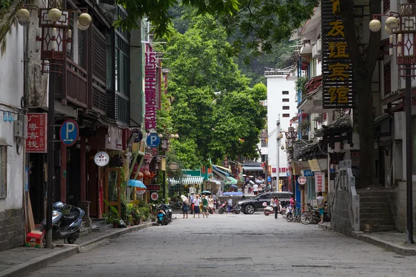 Yangshuo, China - circa July 2015: Streets of tourist town Yangshuo on the banks of Li river in  China