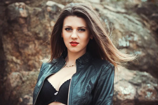 Sexy young woman in leather jacket