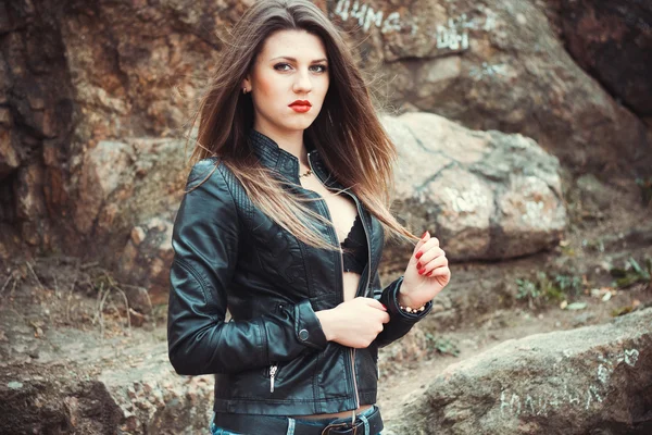 Sexy young woman in leather jacket