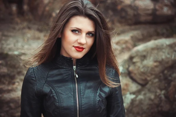 Sexy young woman in leather jacket