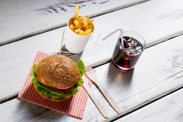 Burger and fries with cola.