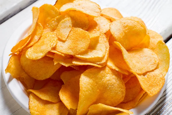 Potato chips on a plate.