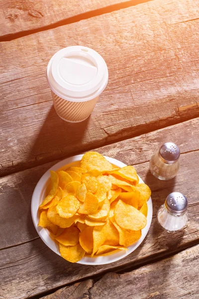 Chips and hot drink cup.