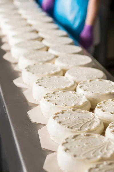 Long rows of white cakes.