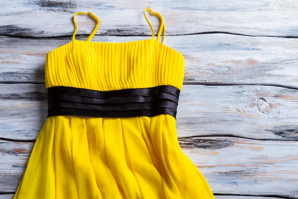 Yellow dress with thin straps.