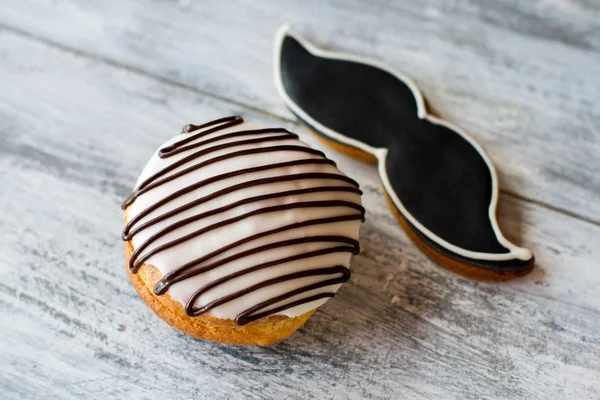 Glazed cookie shaped as moustache.