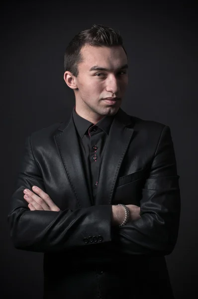 Fashion trendy elegant young man in black suit