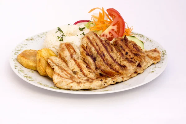 Peruvian Dish: chicken grilled with rice and salad.