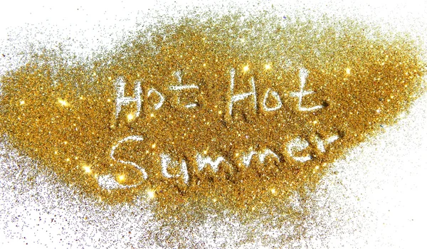 Inscription Hot Hot Summer on golden glitter sparkle on white background