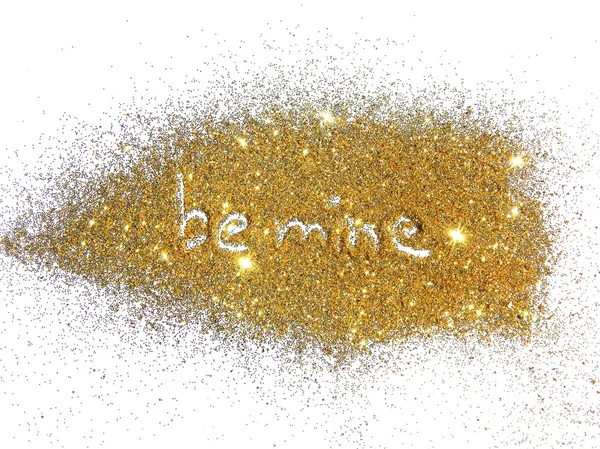 Inscription Be Mine on golden glitter sparkle on white background