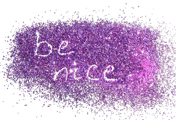 Inscription Be Nice on purple glitter sparkle on white background