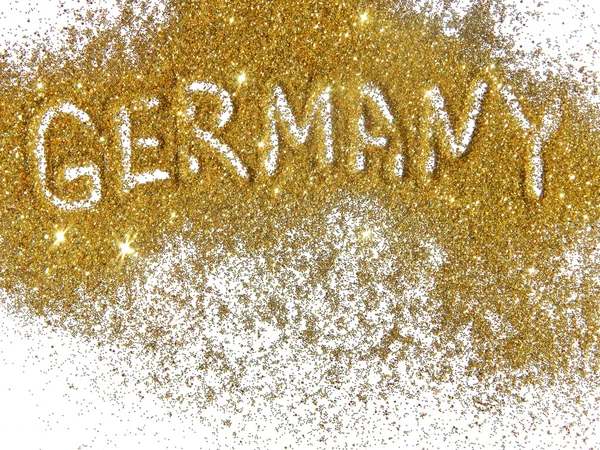 Inscription Germany on golden glitter sparkles on white background