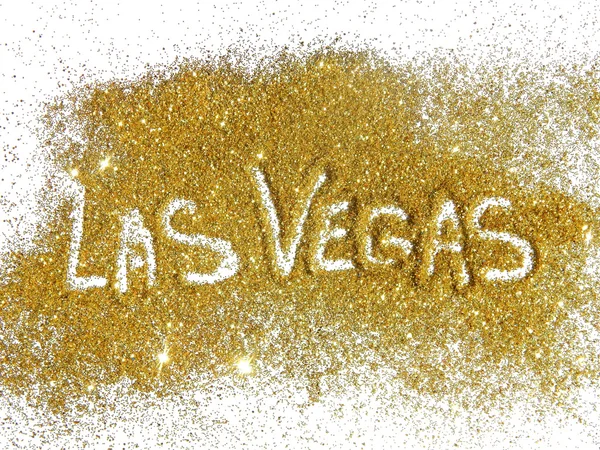 Inscription Las Vegas on golden glitter sparkle on white background