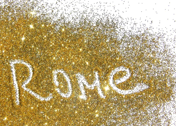 Blurry inscription Rome on golden glitter sparkles on white background