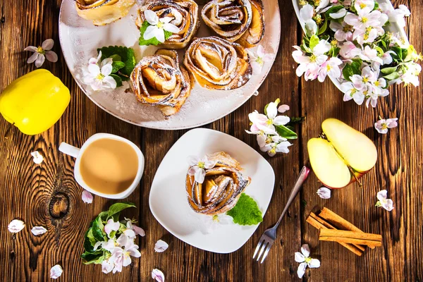 Composition with apple pie and coffee in the rustic style.