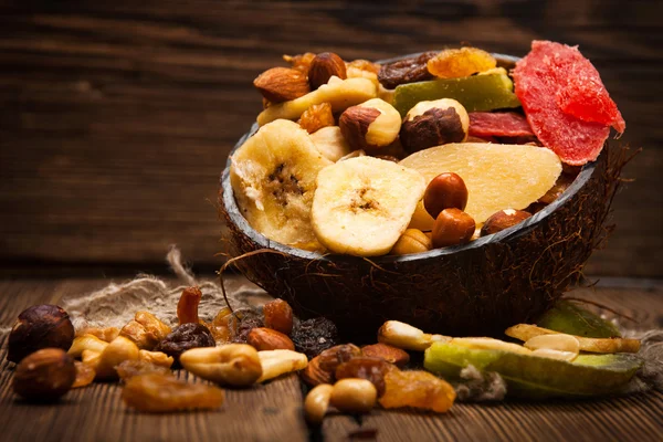 Dried fruits on wooden background