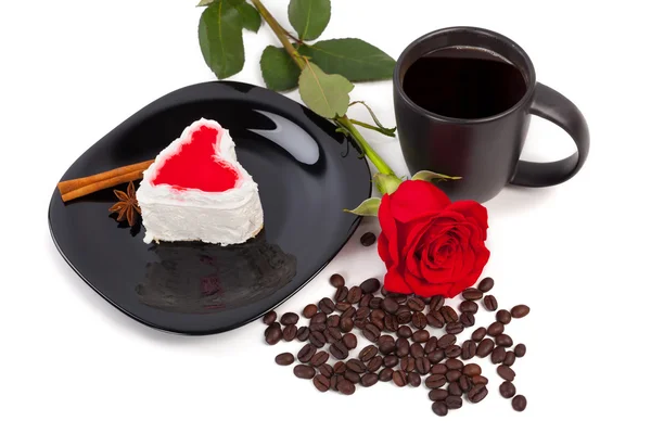 Cup of coffee with cake and rose