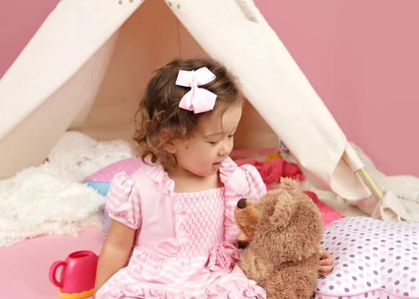 Happy Toddler Girl Playing with Stuffed Bear Toy