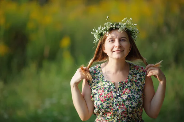 Smiling girl with a wreath