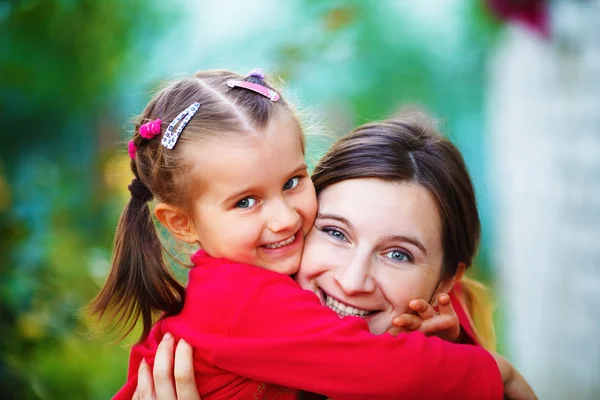 Embrace mom with daughter