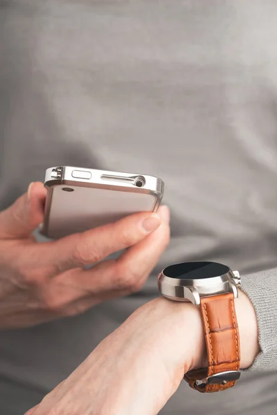 Female hand Phone and Smart Watch