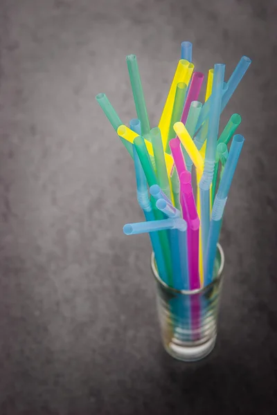 Sticks for a cocktail in a transparent glass