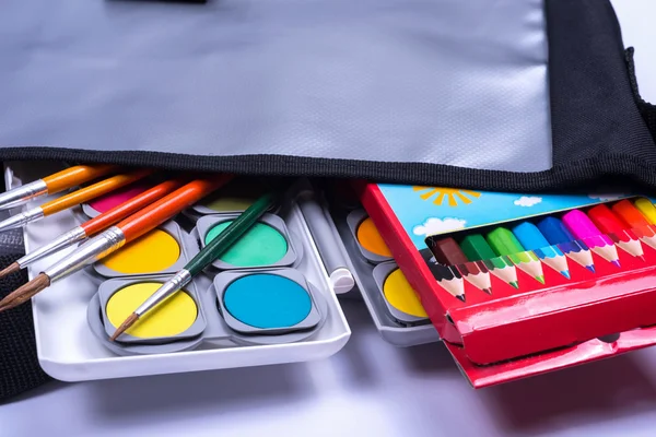 Open bag with colorful items for the school start