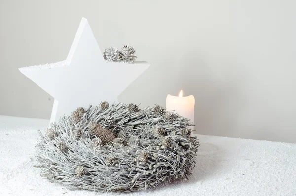 Luxury advent decoration with advent wreath, white candles and white star