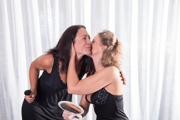Two women kissing
