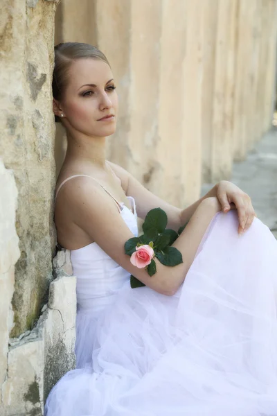 Beautiful ballerina in ancient colonnade