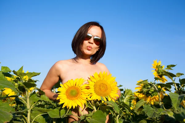 Nude sexy girl with sunflowers