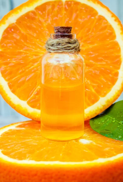 Bottle of orange essential oil for aromatherapy (Extract, tincture, decoction, juice) medicinal properties of orange.